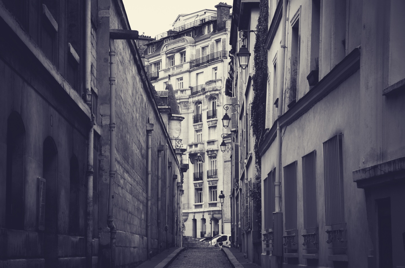 Narrow architectural alleyway in muted tones