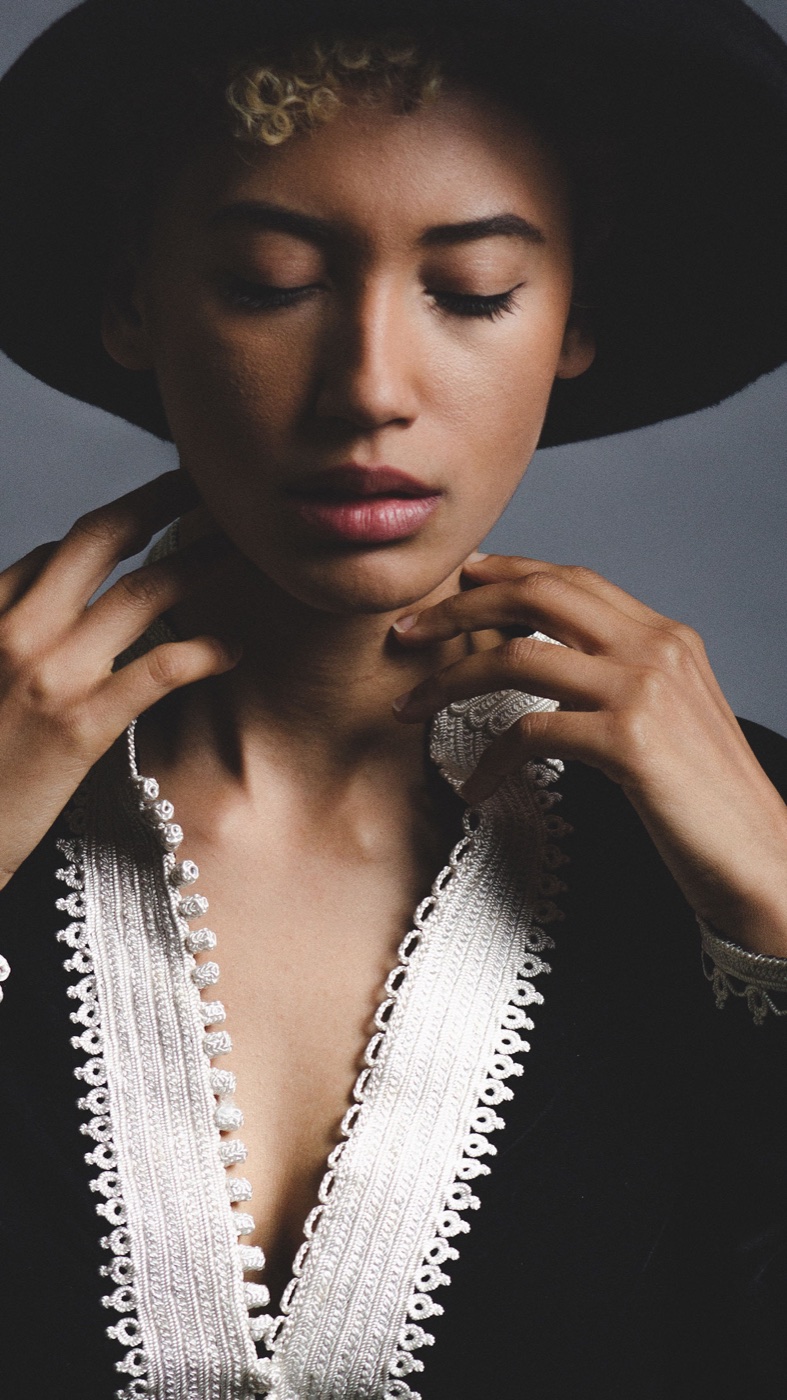 Editorial portrait with jewelry and hands