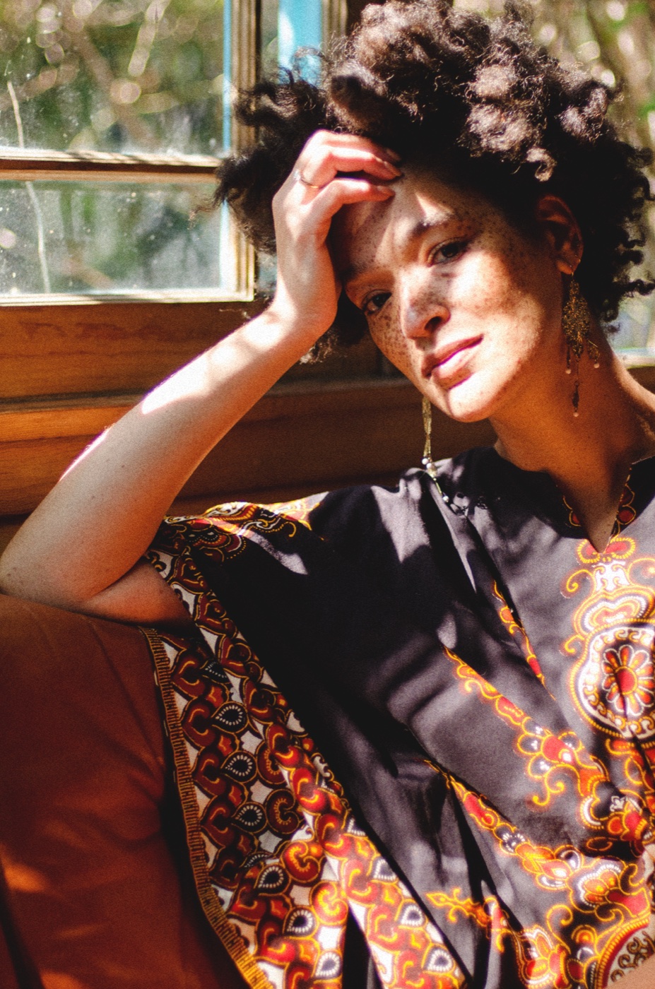 Woman resting in a band of warm sunlight